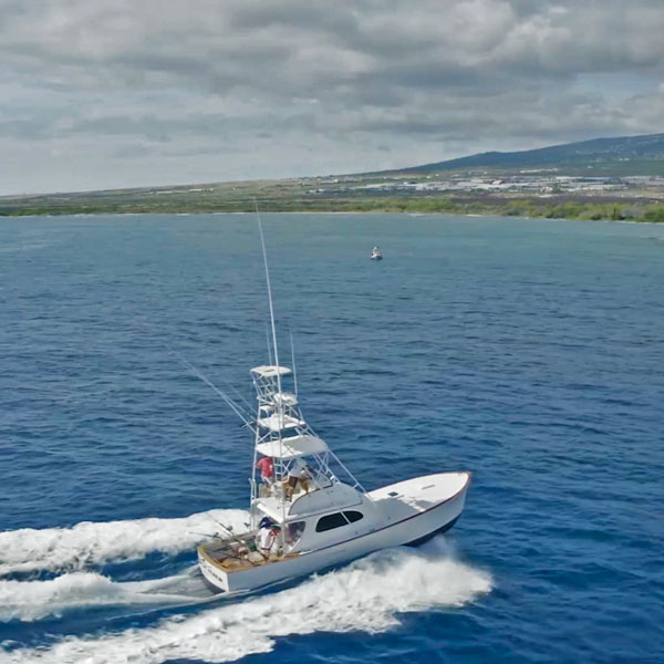 High Flier boat cruising the calm seas off the Kona Coast