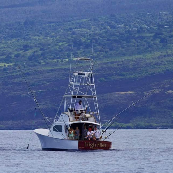 39ft Custom Sportsfisher Boat, the High Flier hooked up to a marlin off the coast of Kona Hawaii